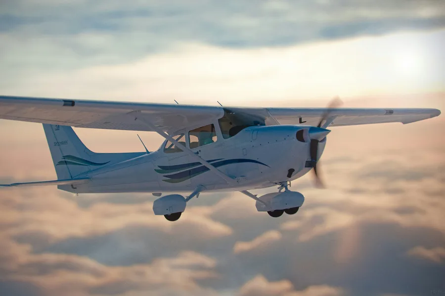 Single-engine Cessna in flight, representing FAA BasicMed exams